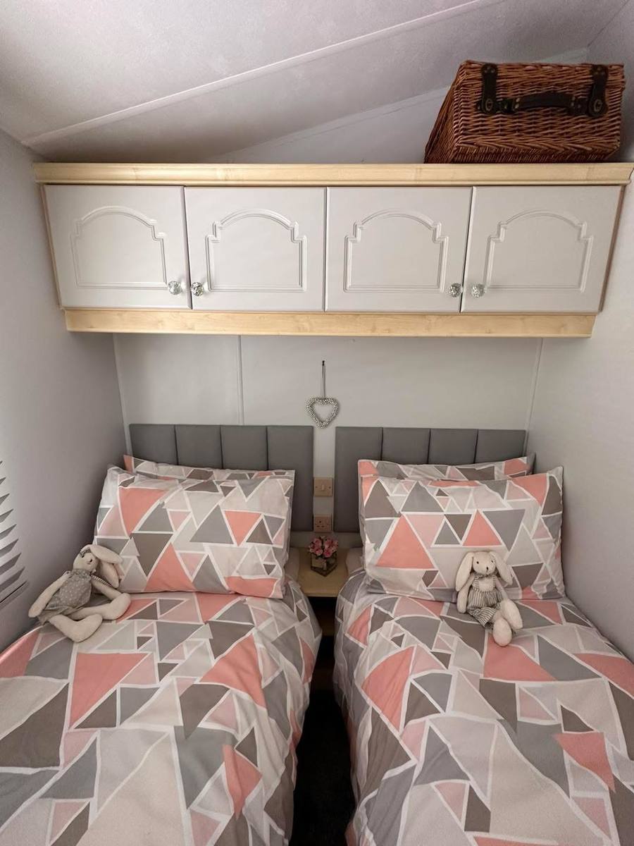 The same over-bed cupboards painted soft grey