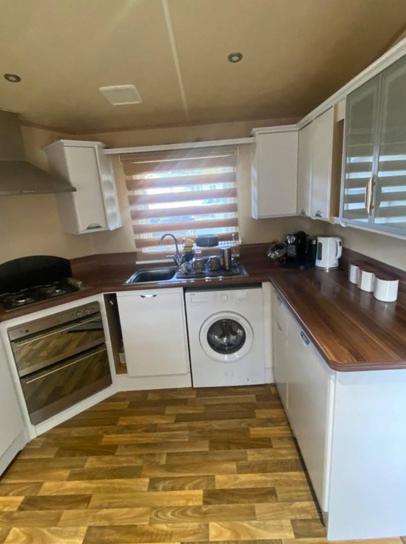 The same kitchen with the units painted white