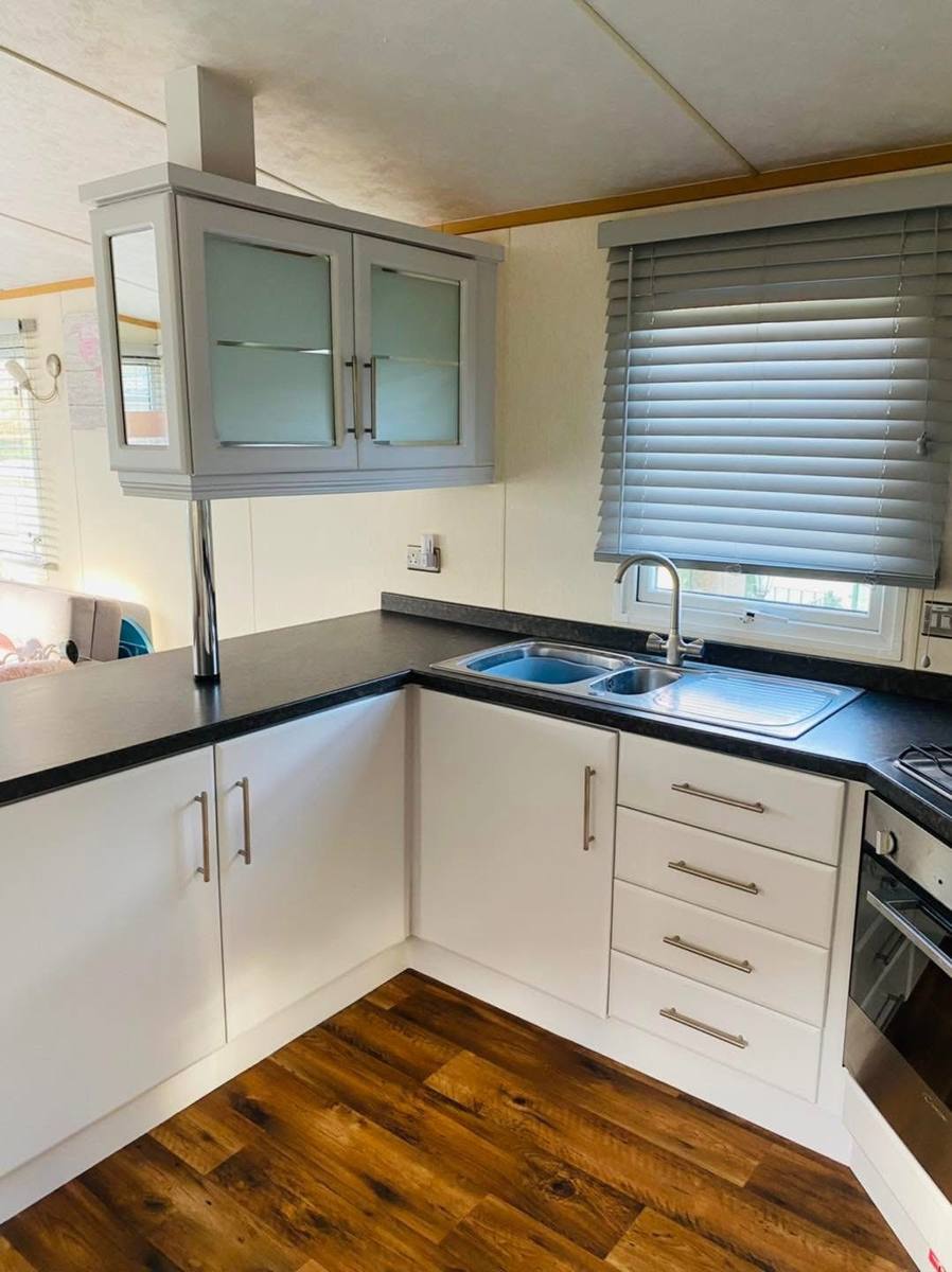 The same kitchen with the units painted white