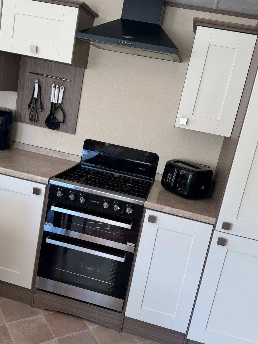 The same cupboards painted cream, seen from another angle